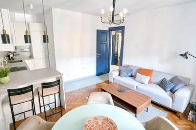 a living room with a couch and a table at Museum Palazzo Suite by MN Property in Kotor