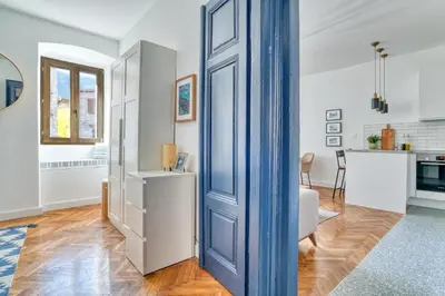 a blue door in a room with a kitchen at Museum Palazzo Suite by MN Property in Kotor