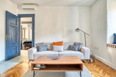 a living room with a couch and a coffee table at Museum Palazzo Suite by MN Property in Kotor