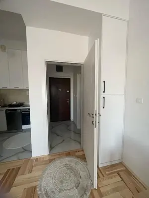 an open door in a room with a kitchen at Studio 78 - Tuški put in Podgorica