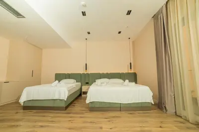 a room with two beds in a room at Hotel Umma in Ulcinj