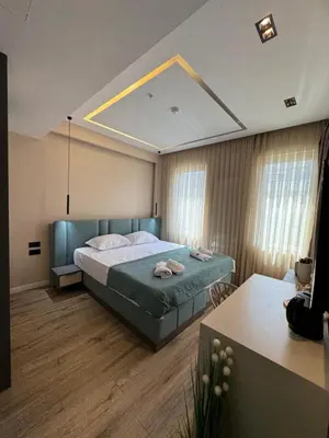 a bedroom with a large bed in a room at Hotel Umma in Ulcinj