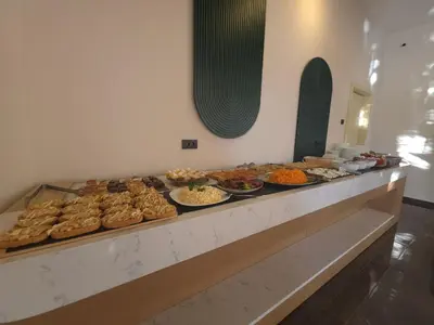 a buffet line with many different types of food at Hotel Umma in Ulcinj