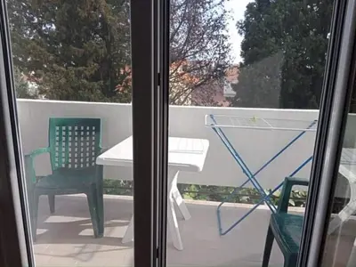a view of a patio with a table and a chair at Studio Dream III soba in Bar