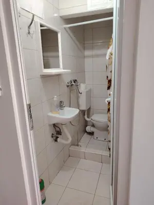 a bathroom with a toilet and a sink at Studio Dream III soba in Bar