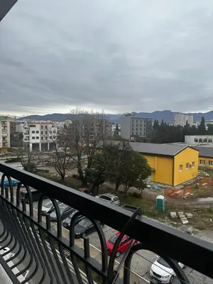 a view of a city from a balcony at Hill Apartment in Podgorica