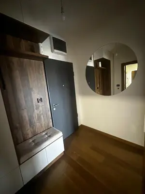 a room with a mirror on the wall at Hill Apartment in Podgorica