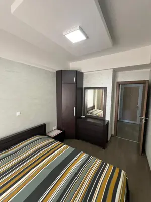 a small bedroom with a bed and a window at Engora 10 Voli in Petrovac na Moru