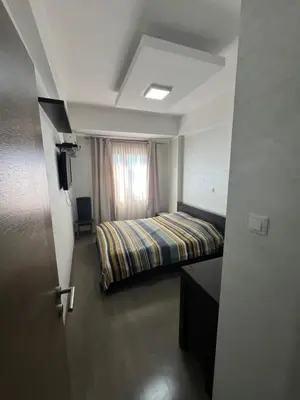a hotel room with a bed and a window at Engora 10 Voli in Petrovac na Moru