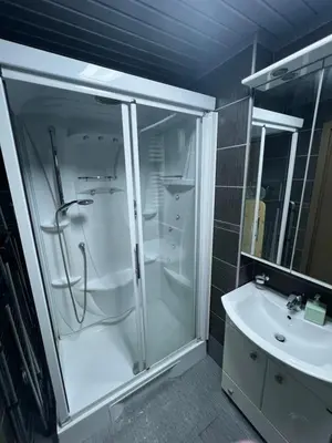 a bathroom with a shower and a sink at Engora 10 Voli in Petrovac na Moru