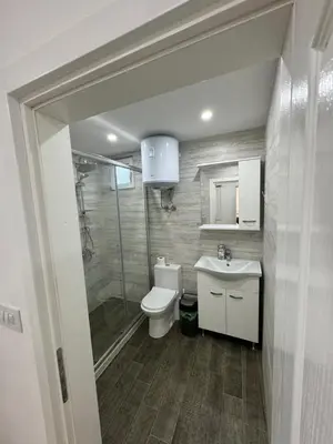 a bathroom with a toilet and a sink and a shower at Eman Villas in Ulcinj