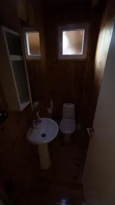 a small bathroom with a sink and a toilet at Villa Ana in Ulcinj