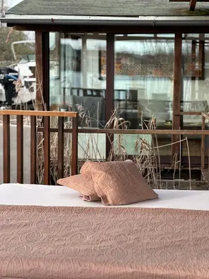 a pillow sitting on top of a bed at Villa Ana in Ulcinj