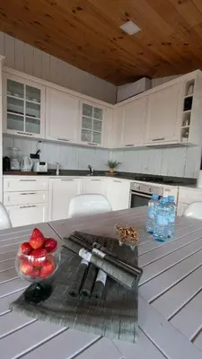 a kitchen with a table with a bowl of fruit on it at Villa Ana in Ulcinj