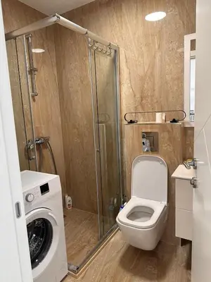 a bathroom with a toilet and a shower at Apartmani Beba in Bar