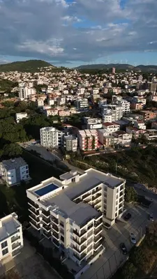 an aerial view of a city with white buildings at Apartmani Beba in Bar