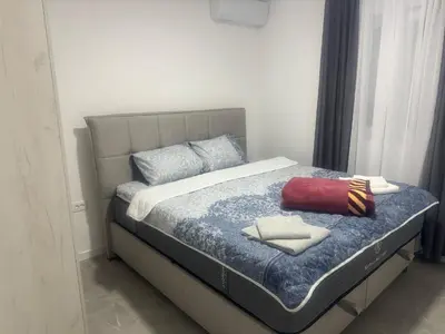 a bedroom with a bed with two towels on it at Vila AS Krimovica in Krimovice