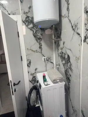 a bathroom with a sink and a toilet in a room at Vila AS Krimovica in Krimovice