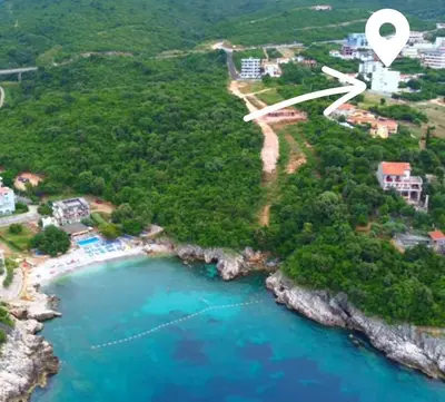 an aerial view of a beach with a white map at Apartment Complex with Pool in Bar, Montenegro in Bar