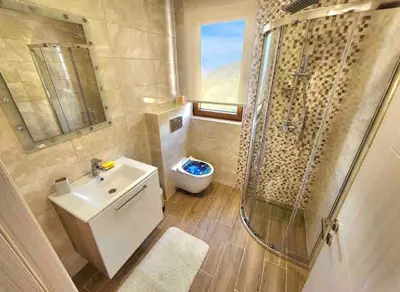 a bathroom with a sink and a shower and a toilet at Villa Trend, Budva, Kuljače in Budva