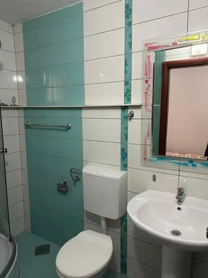 a bathroom with a toilet and a sink at Marija 2 Apartman in Ulcinj