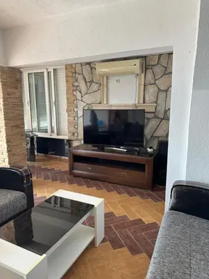 a living room with a flat screen tv at Marija 2 Apartman in Ulcinj