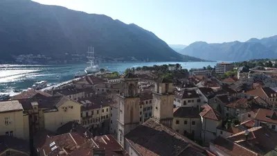 an aerial view of a town next to a river at Panoramic view ! Rooftop garden - Old Town studio in Kotor