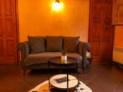 a living room with a couch and a table at Panoramic view ! Rooftop garden - Old Town studio in Kotor
