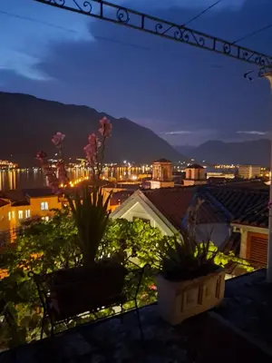 a view of a city from a balcony at night at Romantic Escape - Stunning Rooftop Views - Old Town in Kotor