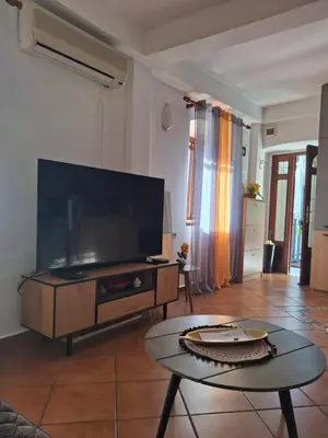 a living room with a large flat screen tv at Romantic Escape - Stunning Rooftop Views - Old Town in Kotor