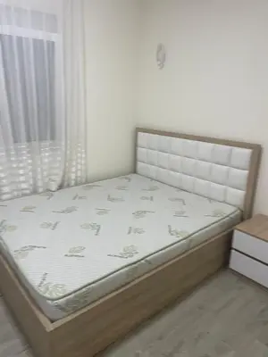 a bed in a room with a bed frame at Leilighet i ulcinj in Ulcinj