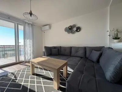 a living room with a couch and a table at Apartment Alex in Dobra Voda