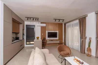 a living room with a couch and a table at Wave Apartments - Dobra Voda in Bar