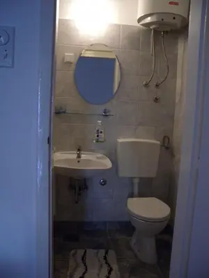 a bathroom with a toilet and a sink at Apartments Markovic Sutomore in Sutomore