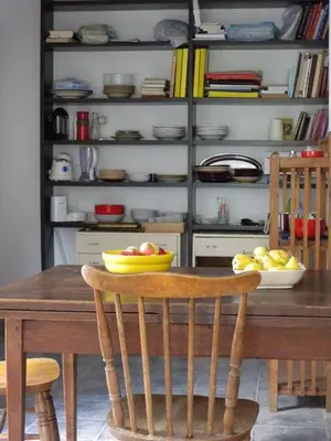 a dining room table with a bowl of fruit on it at Apartments Markovic Sutomore in Sutomore