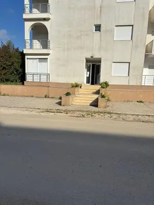 a building with stairs leading to a door at Apartment D&A in Ulcinj