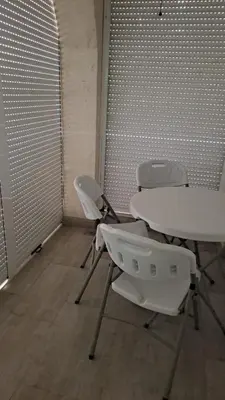 a meeting room with two tables and two chairs at Apartment D&A in Ulcinj