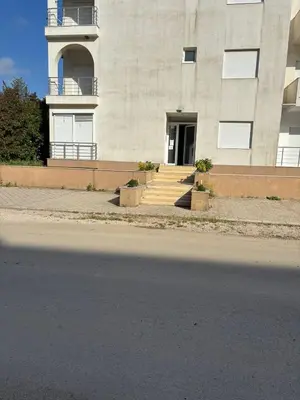 a building with stairs leading to a door at Apartment D&A in Ulcinj