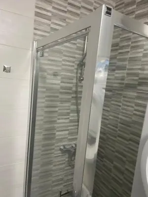a shower with a glass door in a bathroom at Apartment D&A in Ulcinj