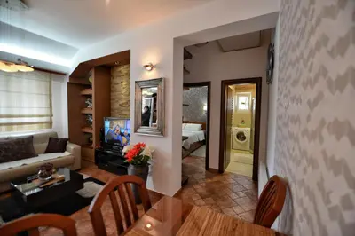a living room with a couch and a table at BMB Apartments Kotor in Kotor
