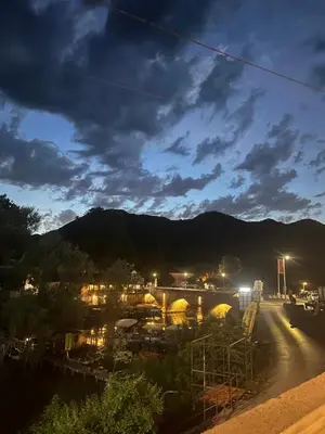 a view of a city at night at Apartment Stari Konak in Virpazar
