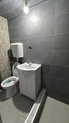 a bathroom with a toilet and a sink at A little paradise in Kotor