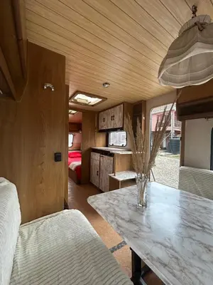 a kitchen and dining area of a rv with a table at A little paradise in Kotor