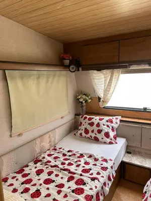 a bed in a small room with a window at A little paradise in Kotor