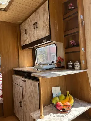 a kitchen with a bowl of fruit and a microwave at A little paradise in Kotor