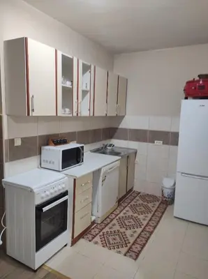 a kitchen with white appliances and a white refrigerator at Tanla in Danilovgrad