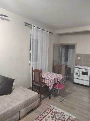 a living room with a table and a couch at Tanla in Danilovgrad