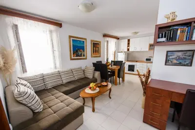 a living room with a couch and a table at Apartment Marko in Kotor