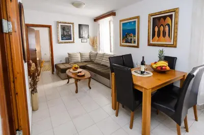 a living room with a couch and a table at Apartment Marko in Kotor
