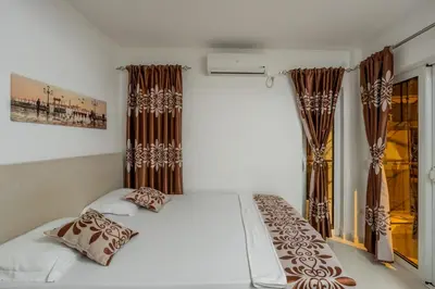 a bedroom with a bed and a window at Ponte di Ferro in Budva